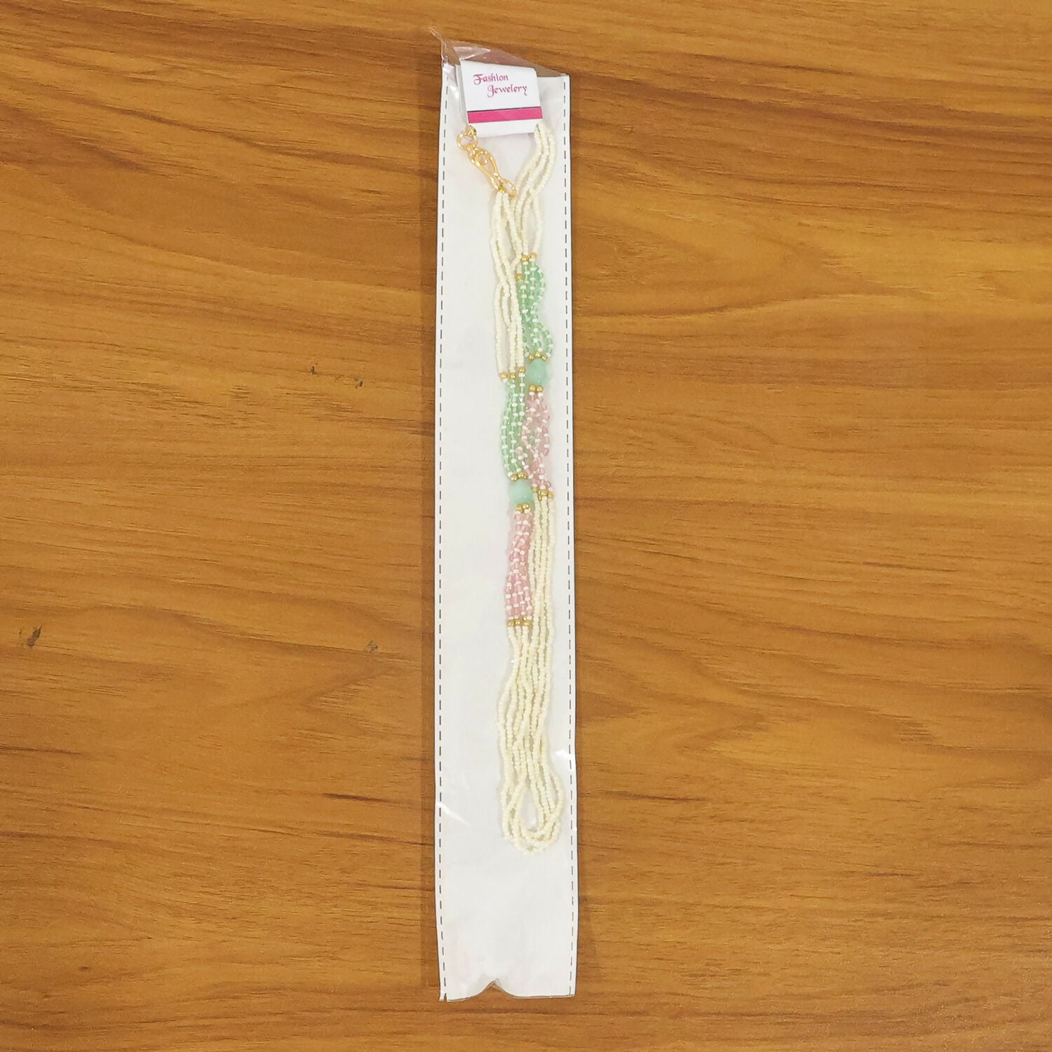 Handmade pearl mala necklace with pastel beads styled on display