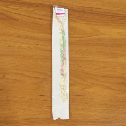 Handmade pearl mala necklace with pastel beads styled on display