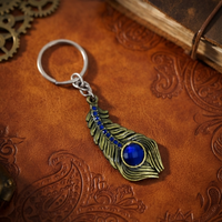 Blue Stone Peacock Feather Keychain with Silver Tone Decorative Design