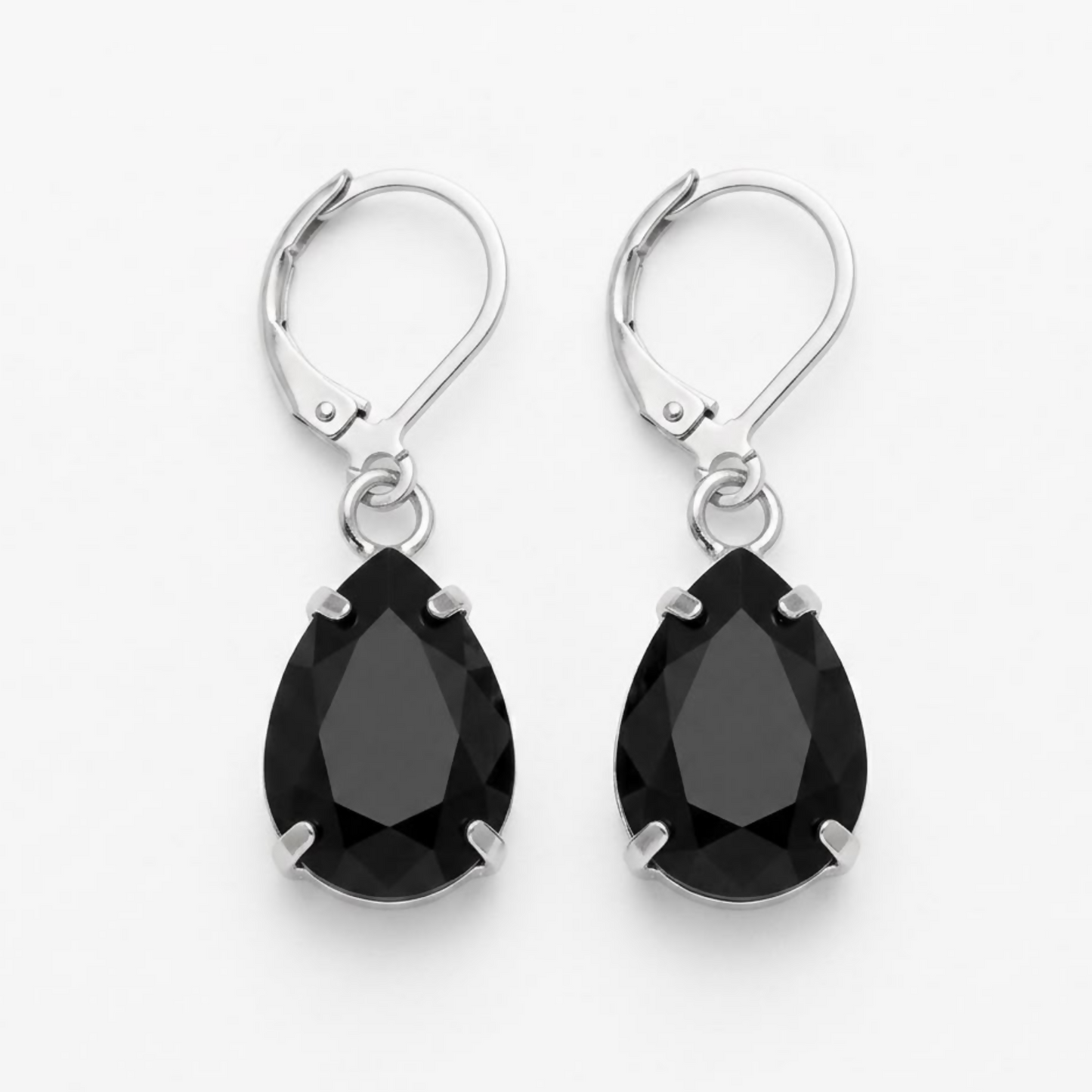 A pair of black teardrop crystal earrings with silver lever-back clasps, isolated on a white background.