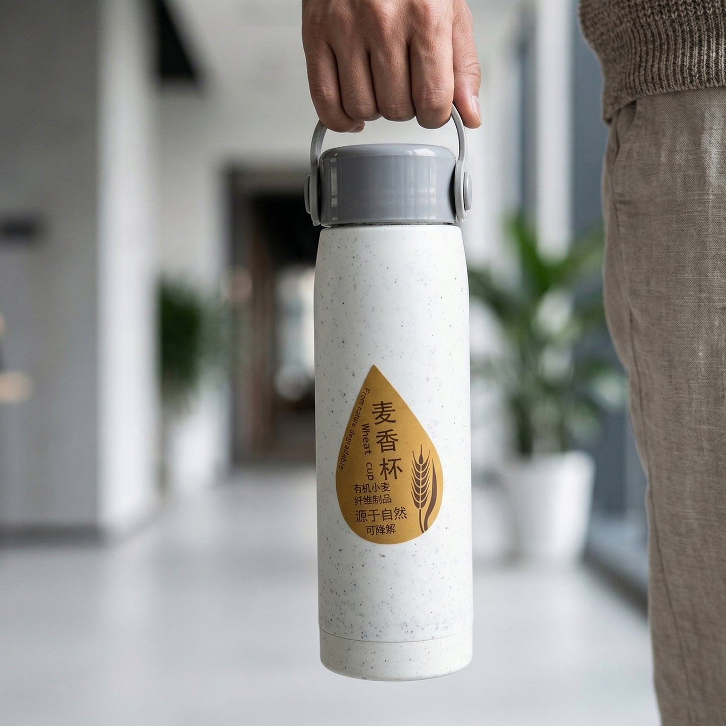 Glass water bottle highlighting ergonomic design