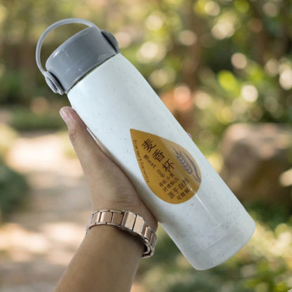 Portable water bottle with phone holder, side view