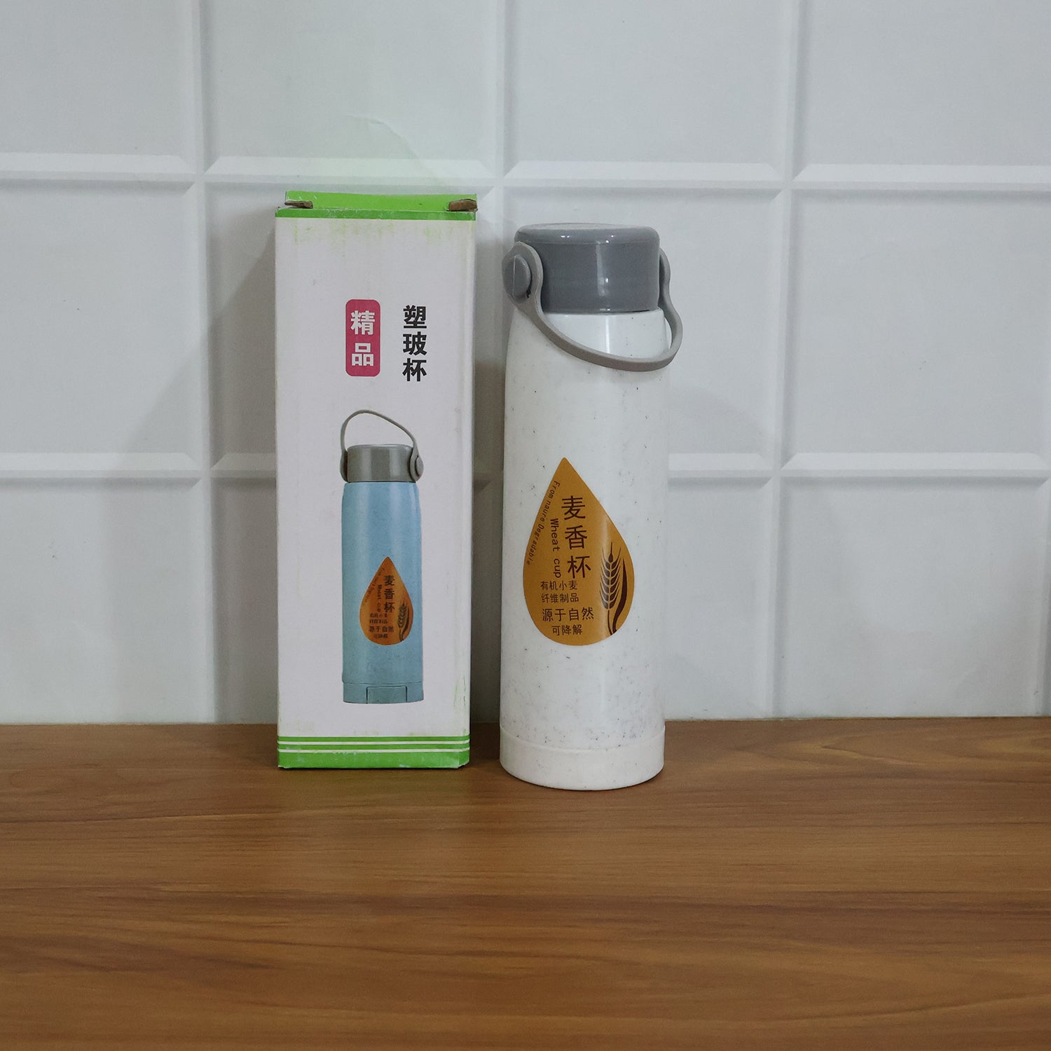 Lifestyle image of glass water bottle used at office desk