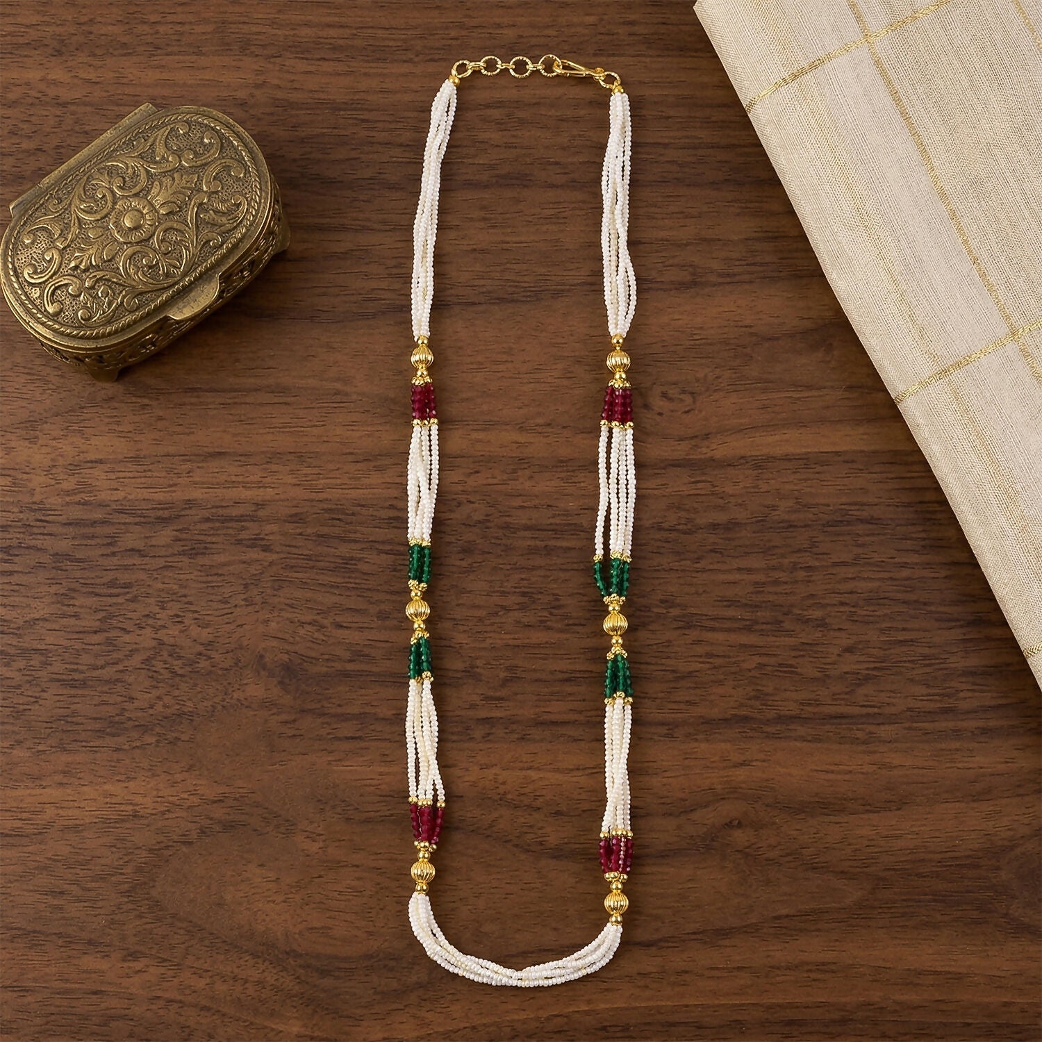 White beaded mala necklace worn with traditional outfit