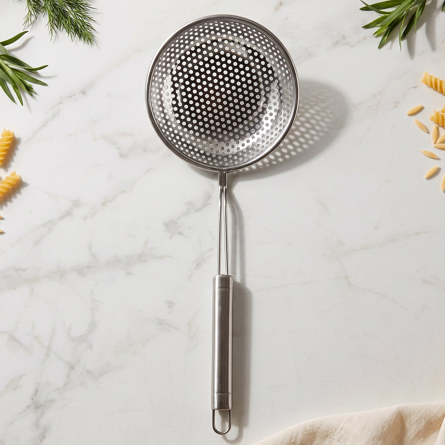 Skimmer spoon used for draining and serving