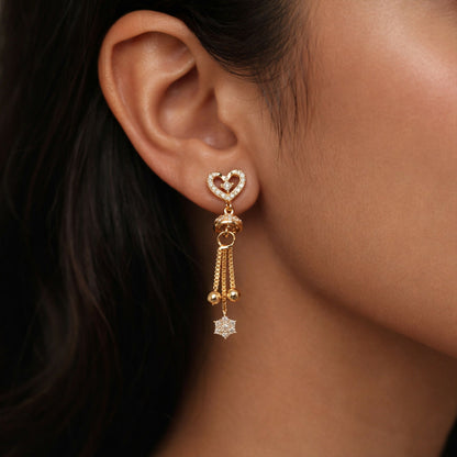 Side angle of elegant double heart crystal drop earrings with cascading chain tassels