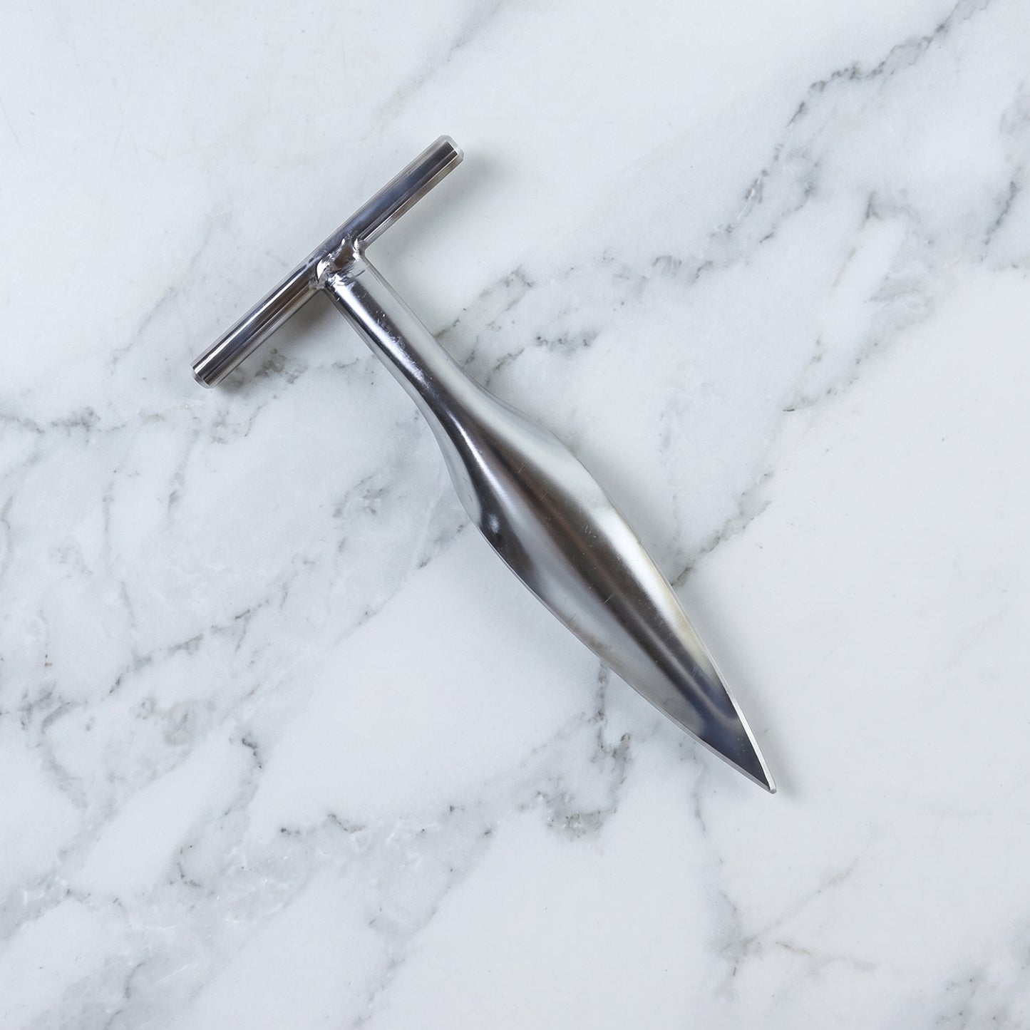 Stainless steel coconut breaker set on white background
