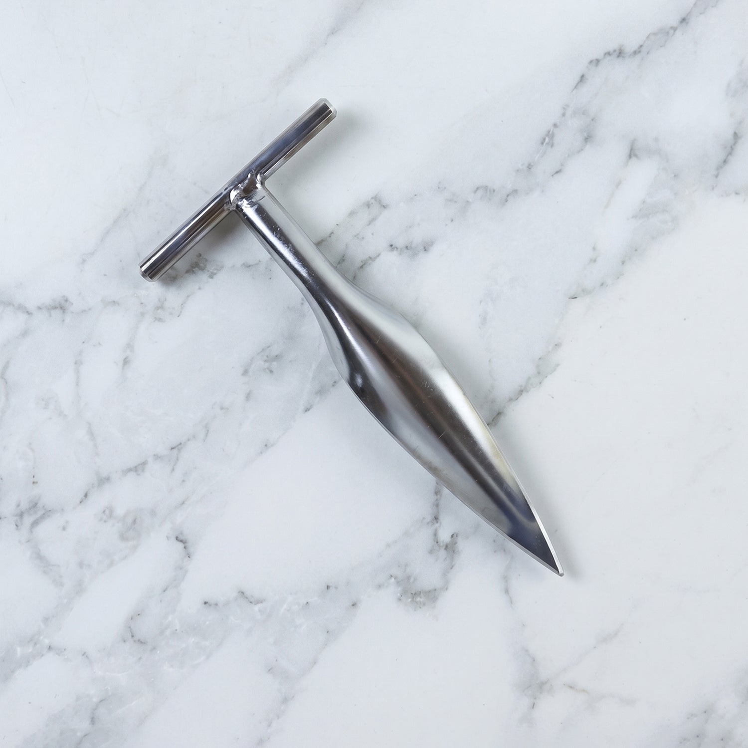 Stainless steel coconut breaker set on white background