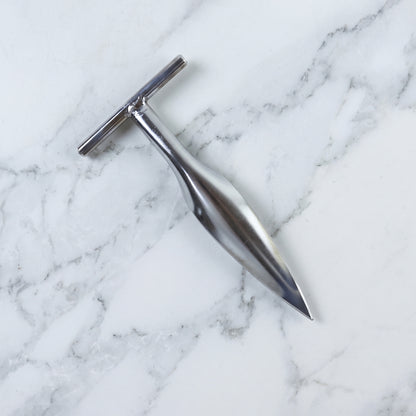 Stainless steel coconut breaker set on white background