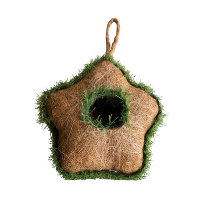 Handmade coir bird house hanging in garden setting