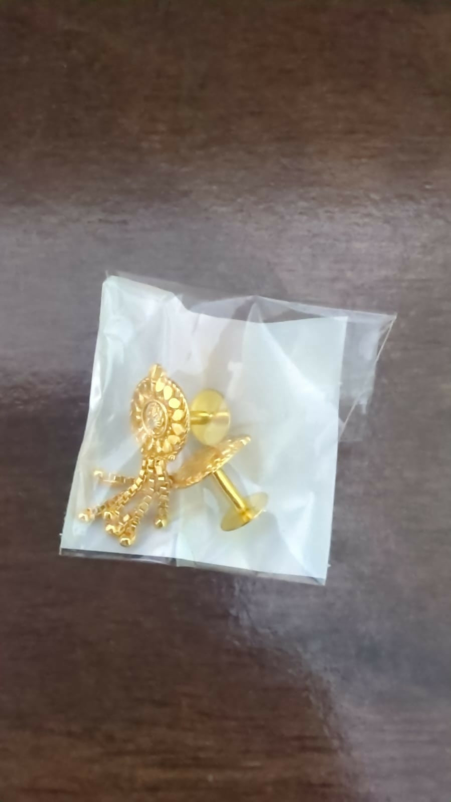 Traditional golden jhumka earrings ideal for Indian festivals and weddings