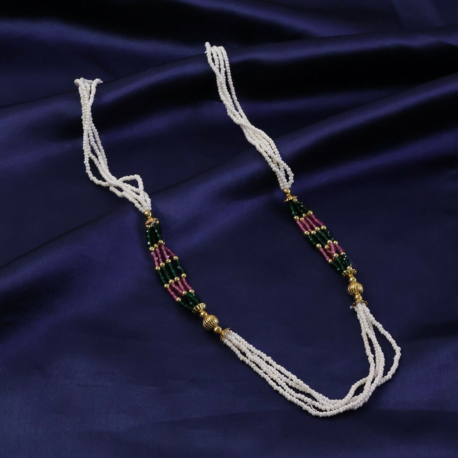 Side view of multi-strand white mala necklace showcasing beadwork