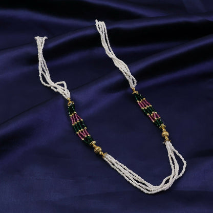 Side view of multi-strand white mala necklace showcasing beadwork