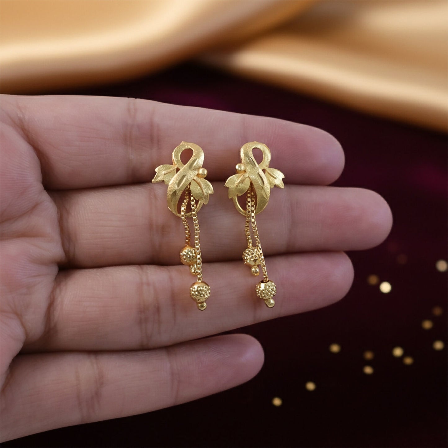 Regal Botanical Motif Gold Drop Earrings with Cascading Chain Bead Accents
