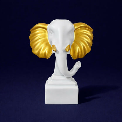 Side view of white gold elephant figurine decorative statue