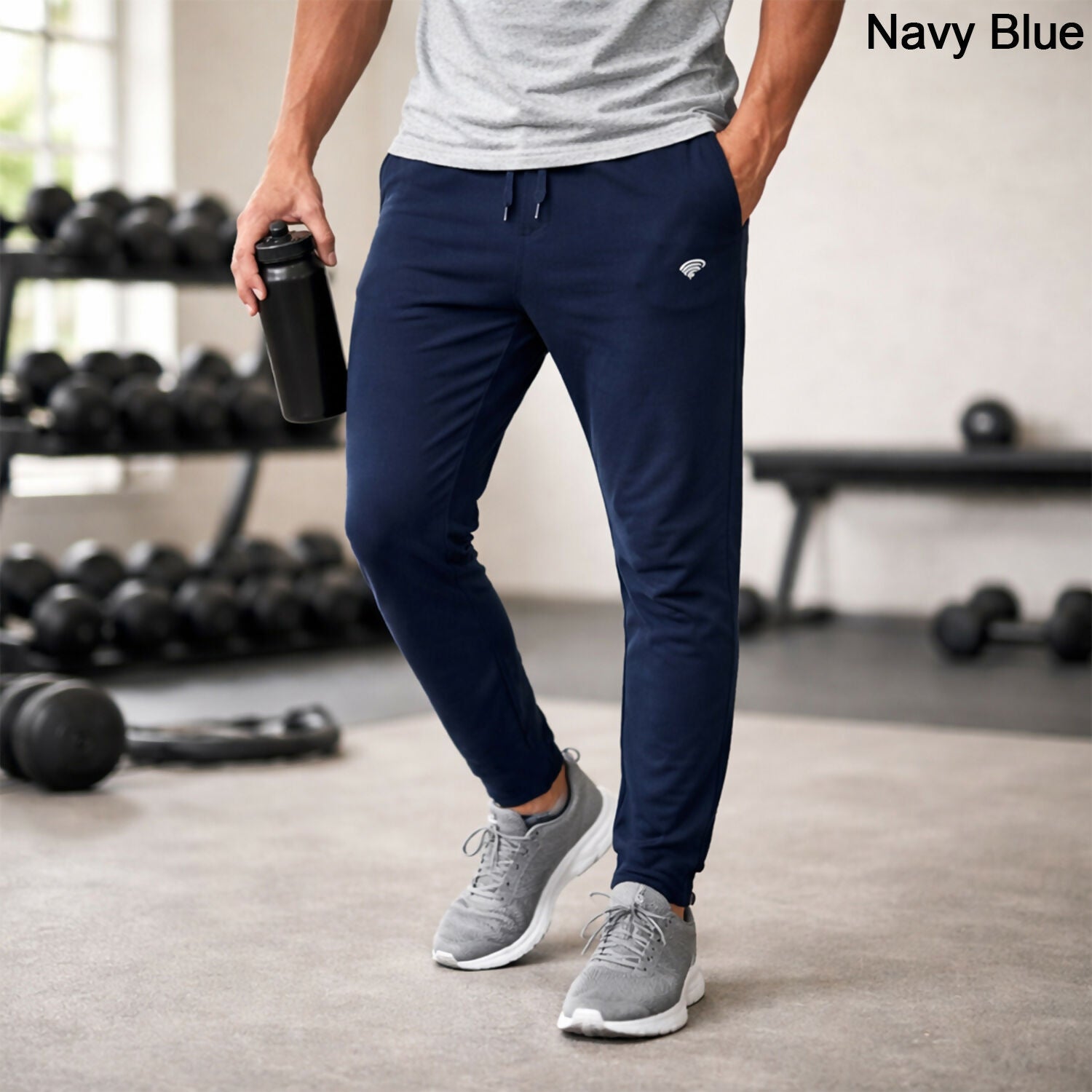 Men's slim fit premium stretch sports track pants in navy blue, front view