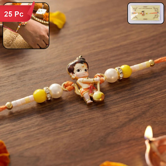 A Bal Hanuman charm, holding a mace, is centered on an orange thread with yellow and pearl beads, on a wooden surface.