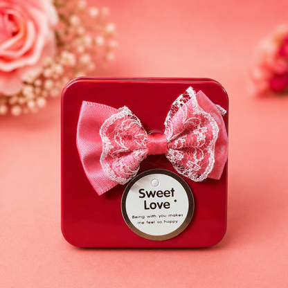 Glossy metal mini gift box with decorative bow and tag