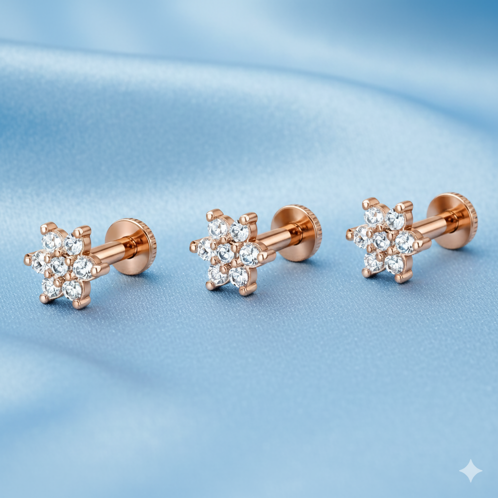 Close-up of rose gold floral studs with brilliant crystal detailing on each petal