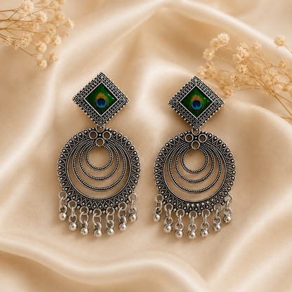 Stunning oxidised peacock feather chandbali jhumka earrings for ethnic wear.