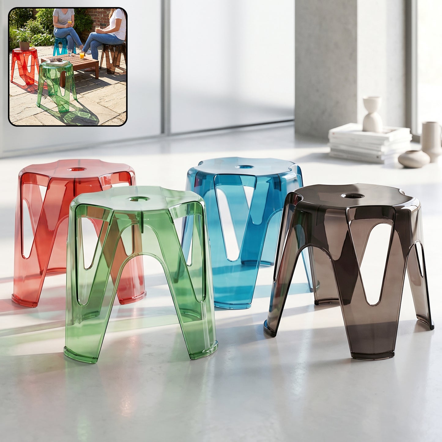 A set of transparent plastic stools arranged in a modern living room setting.