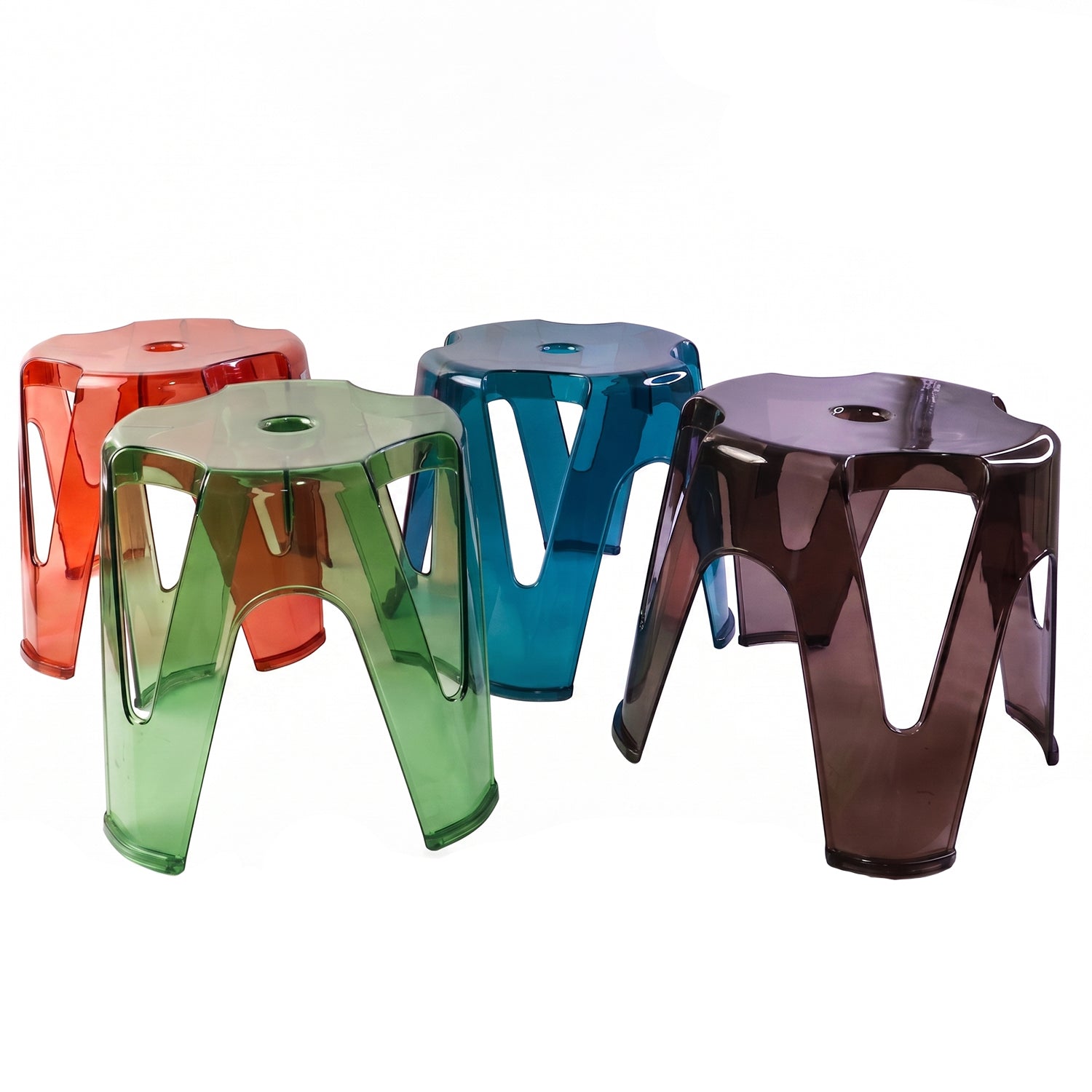 Multiple transparent plastic stools arranged in an outdoor garden setting.