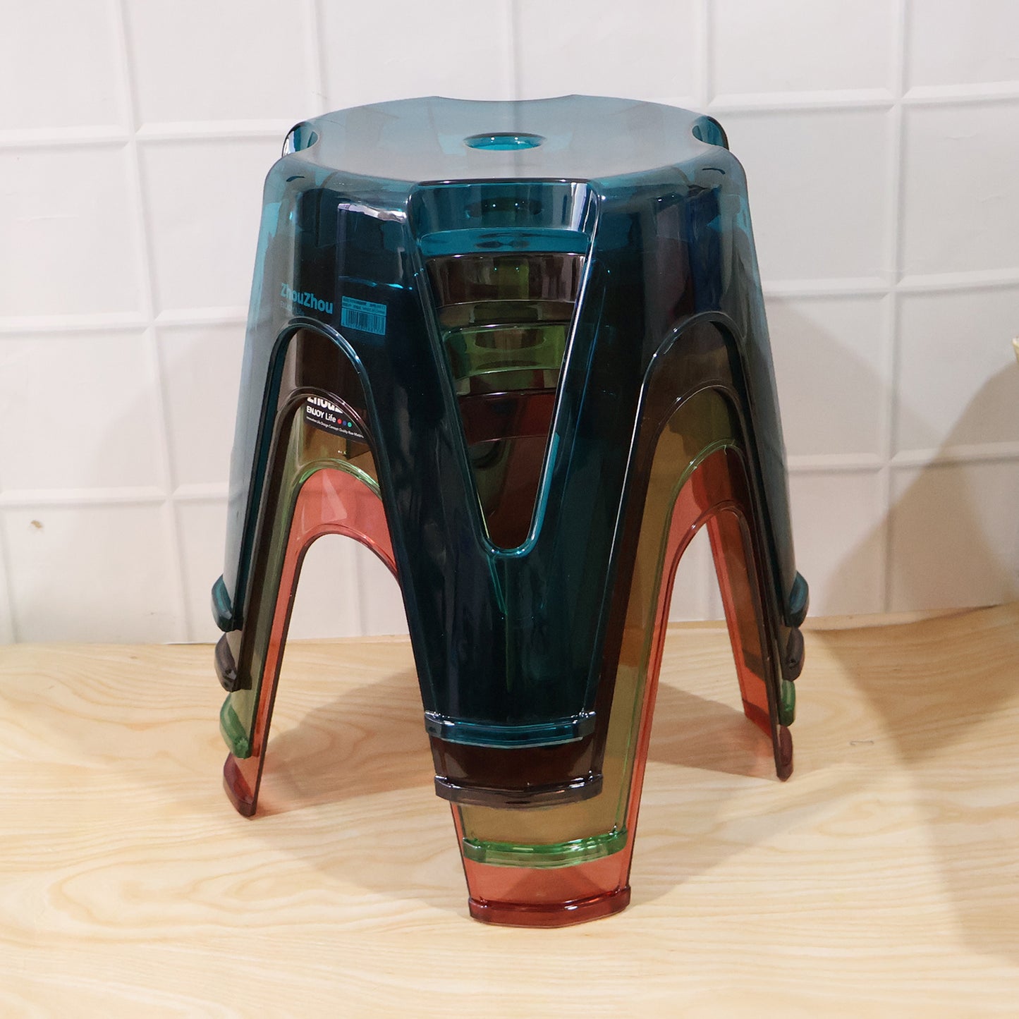 Transparent plastic stools positioned on a balcony, perfect for outdoor relaxation.