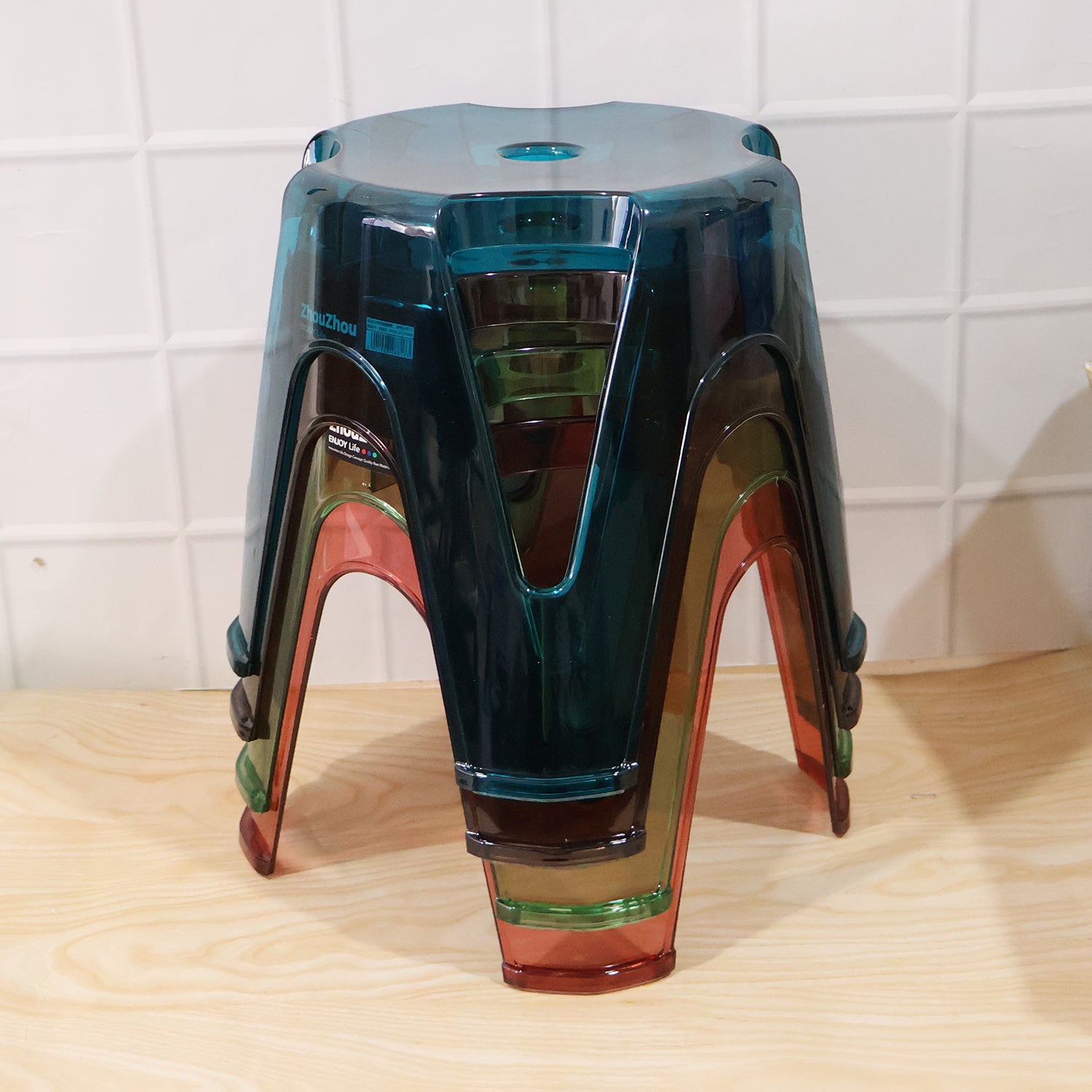 Transparent plastic stools positioned on a balcony, perfect for outdoor relaxation.
