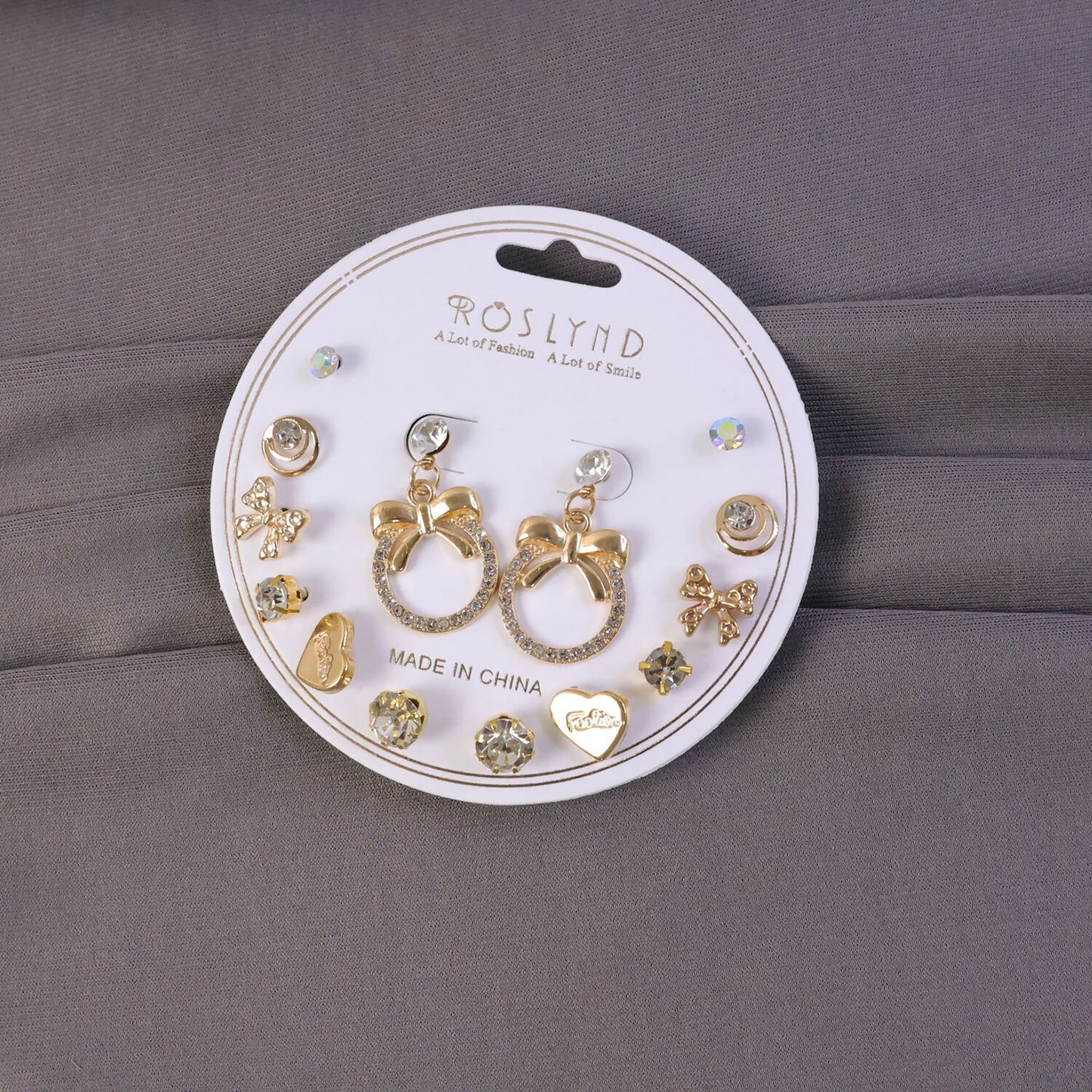 Close-up view of premium gold plated leaf pearl drop earring with a trendy style