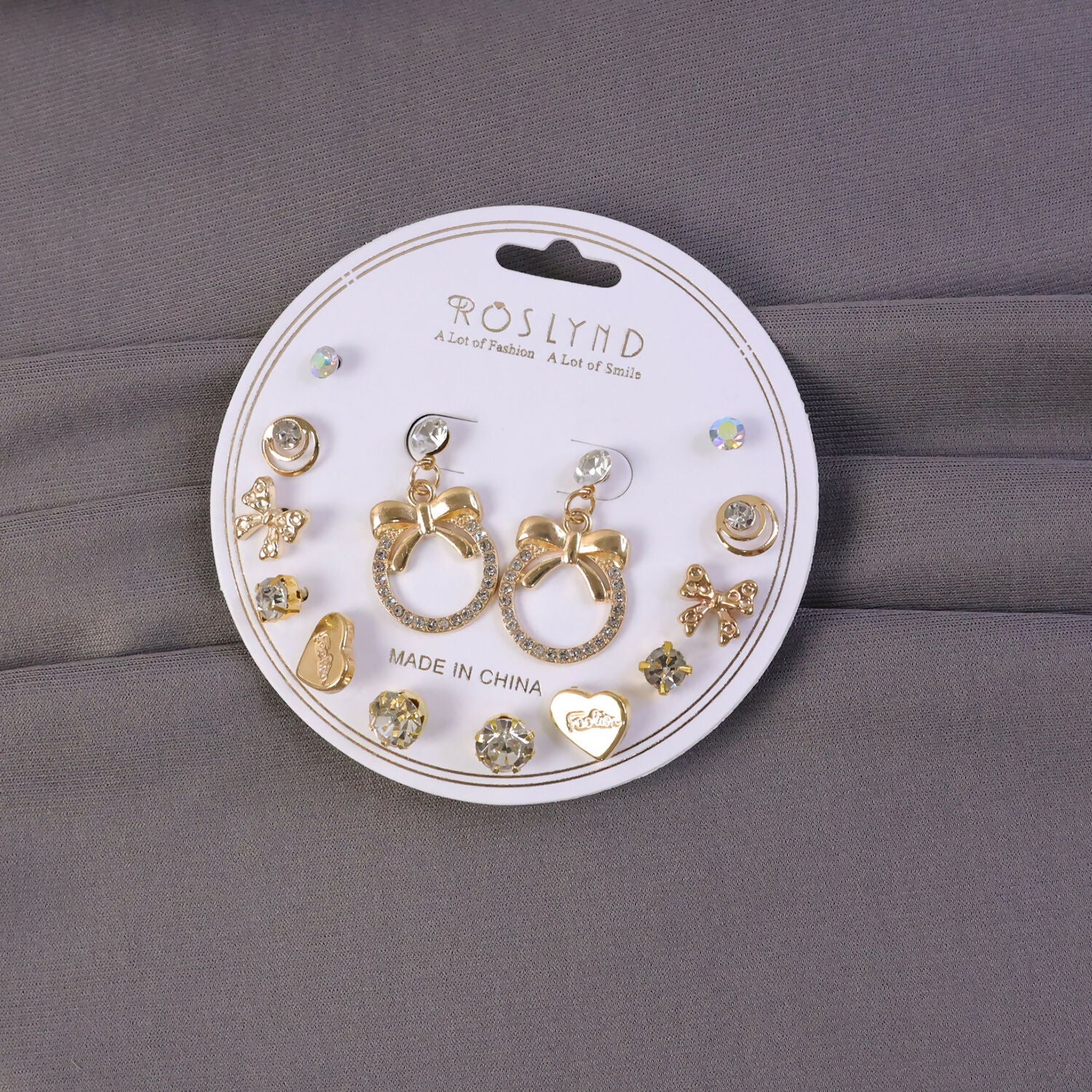 Close-up view of premium gold plated leaf pearl drop earring with a trendy style
