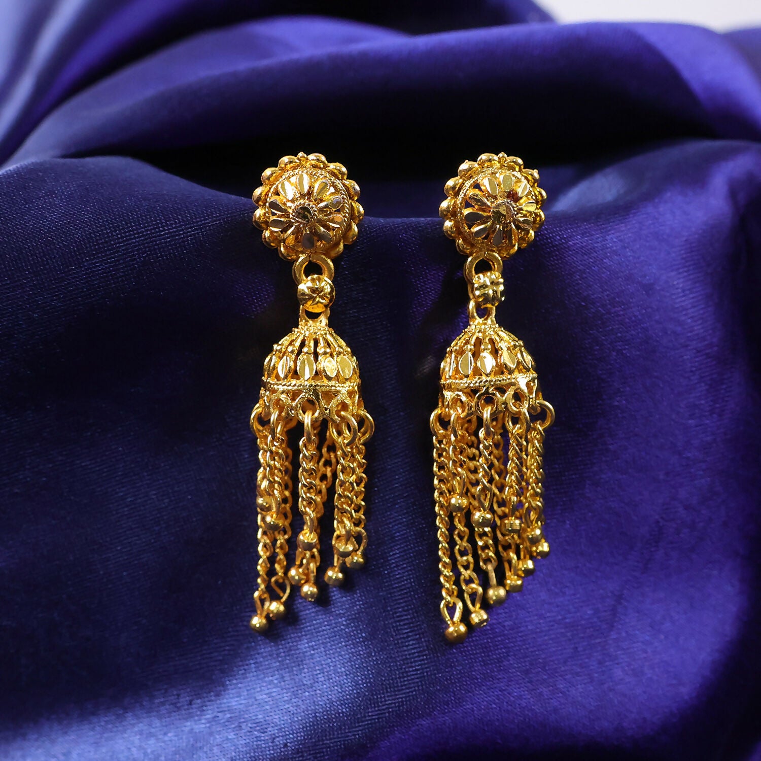 Front view of gold plated jhumka earrings for ethnic occasions