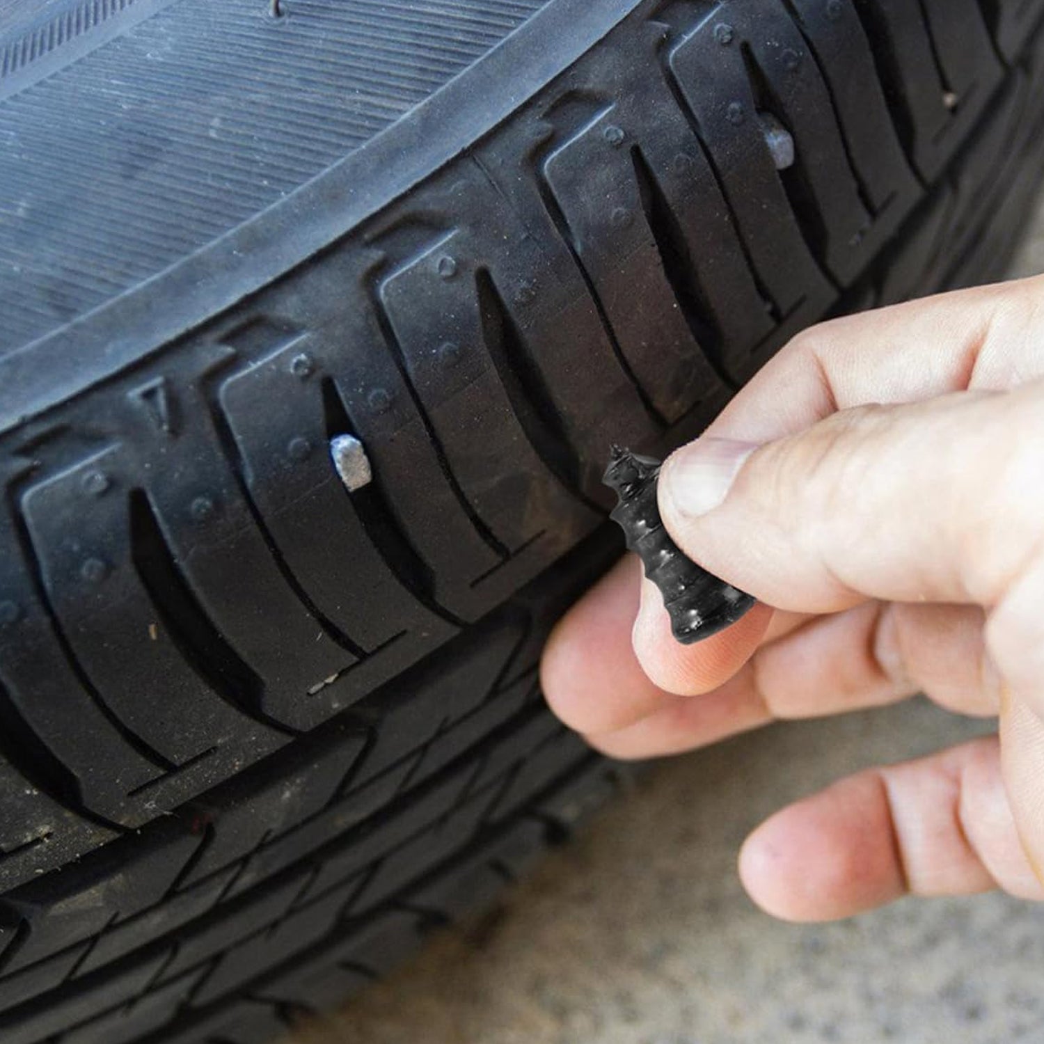 Close-up image of pink tire repair nail plug