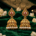 Traditional Gold Tone Jhumka Earrings with Red Center Accents and Pearl-Style Drops