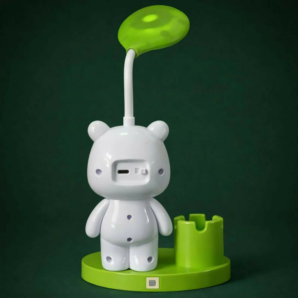 The back of a white panda lamp with a green light and base, showing a charging port and switch.
