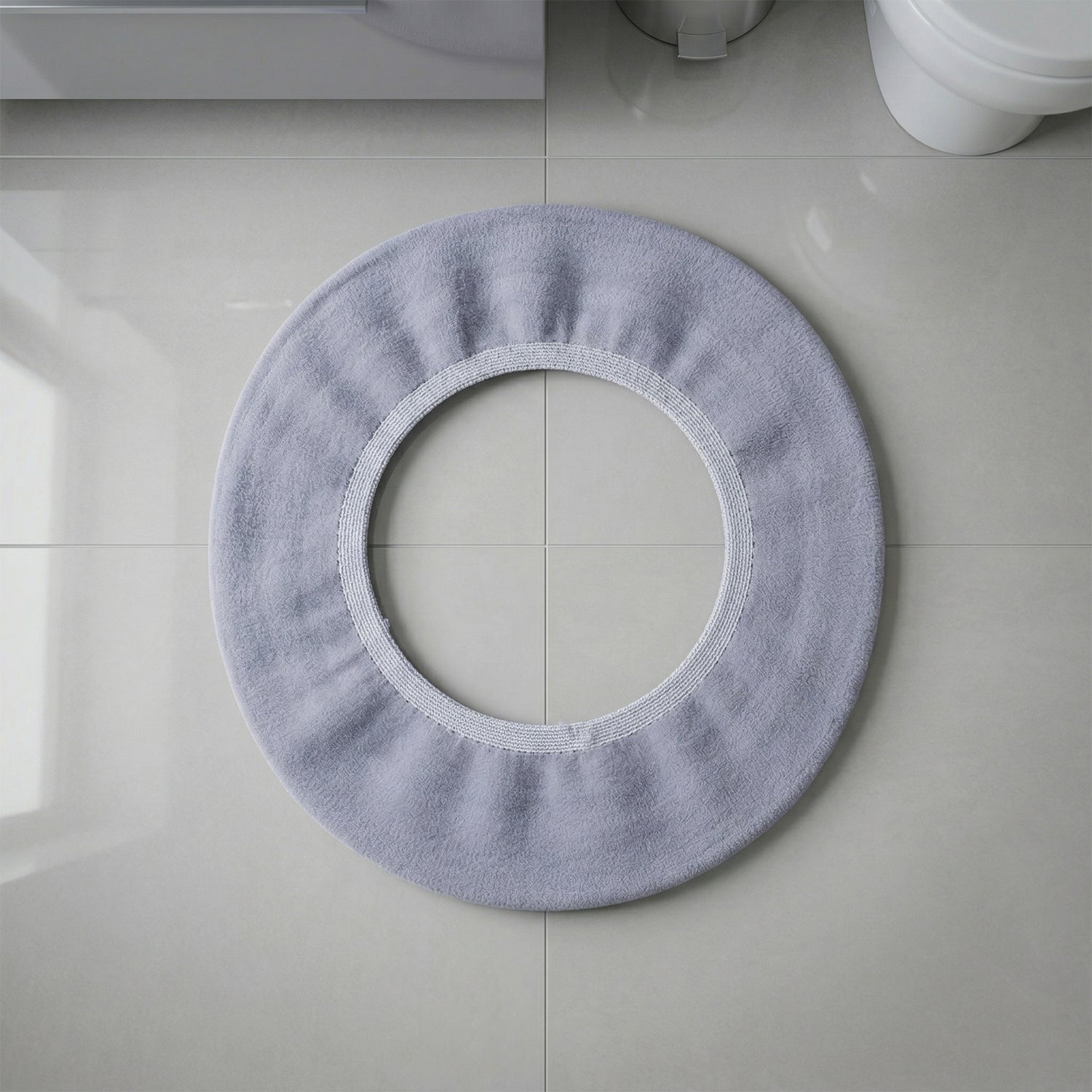 Stretchable toilet seat cover shown separately