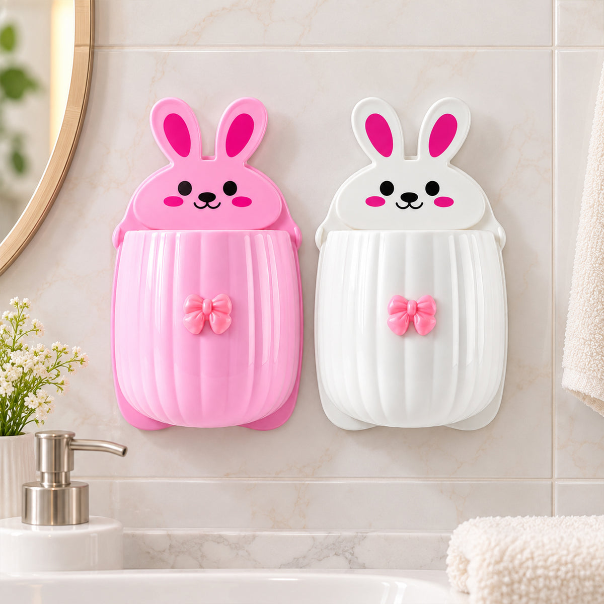 Pink and white rabbit organizers mounted on a light gray tiled wall, positioned above a white sink and faucet.