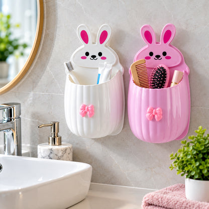 White and pink rabbit organizers on a bathroom wall, holding various toiletries like toothbrushes, combs, and brushes.