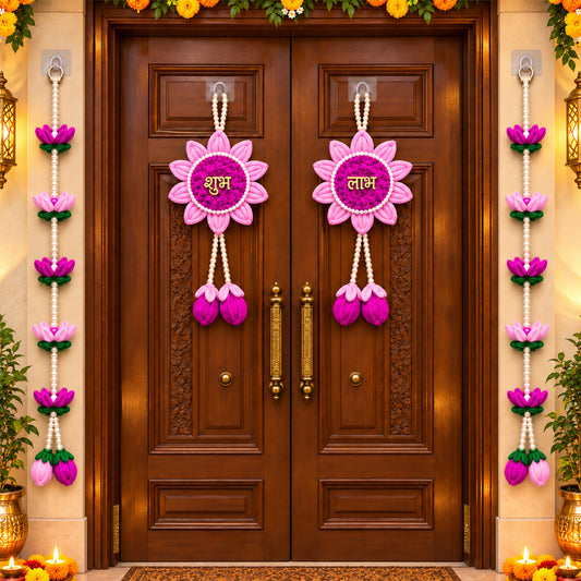 Two pink and purple lotus flower hangings with pearl beads on a brown wooden door, surrounded by marigold garlands.