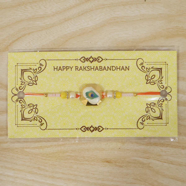 Peacock Feather Rakhi showcasing its complete design and colours.