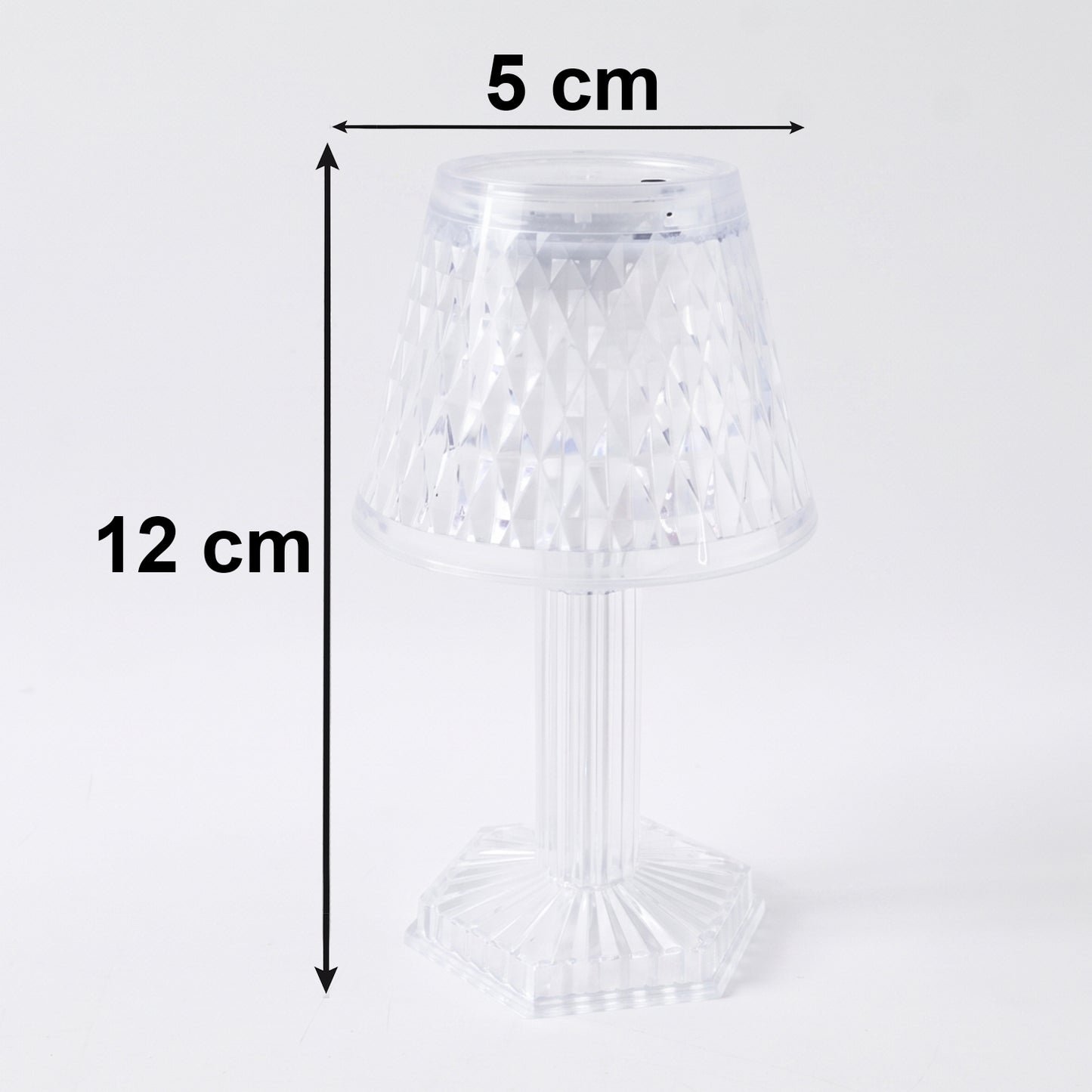 Small crystal lamp casting decorative light