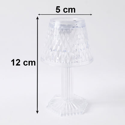 Small crystal lamp casting decorative light
