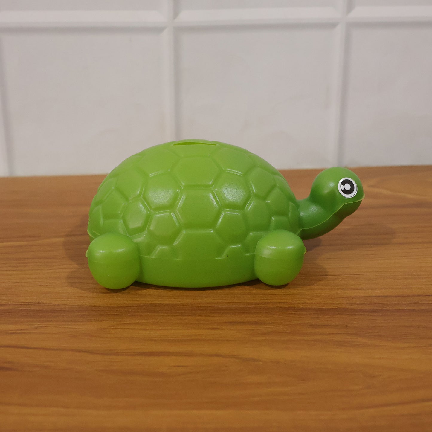 Turtle money bank in a room setting