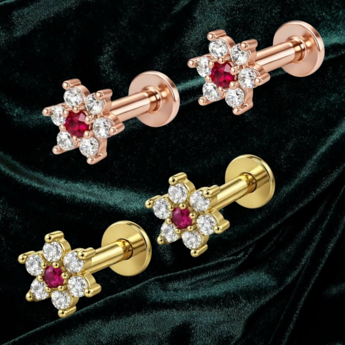 Close-up of flower labret AD stud earrings featuring ruby centre in gold plating