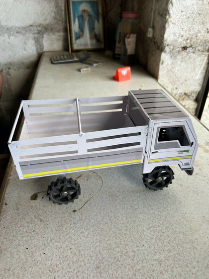 Close-up of handcrafted metal kids cargo truck toy with realistic details