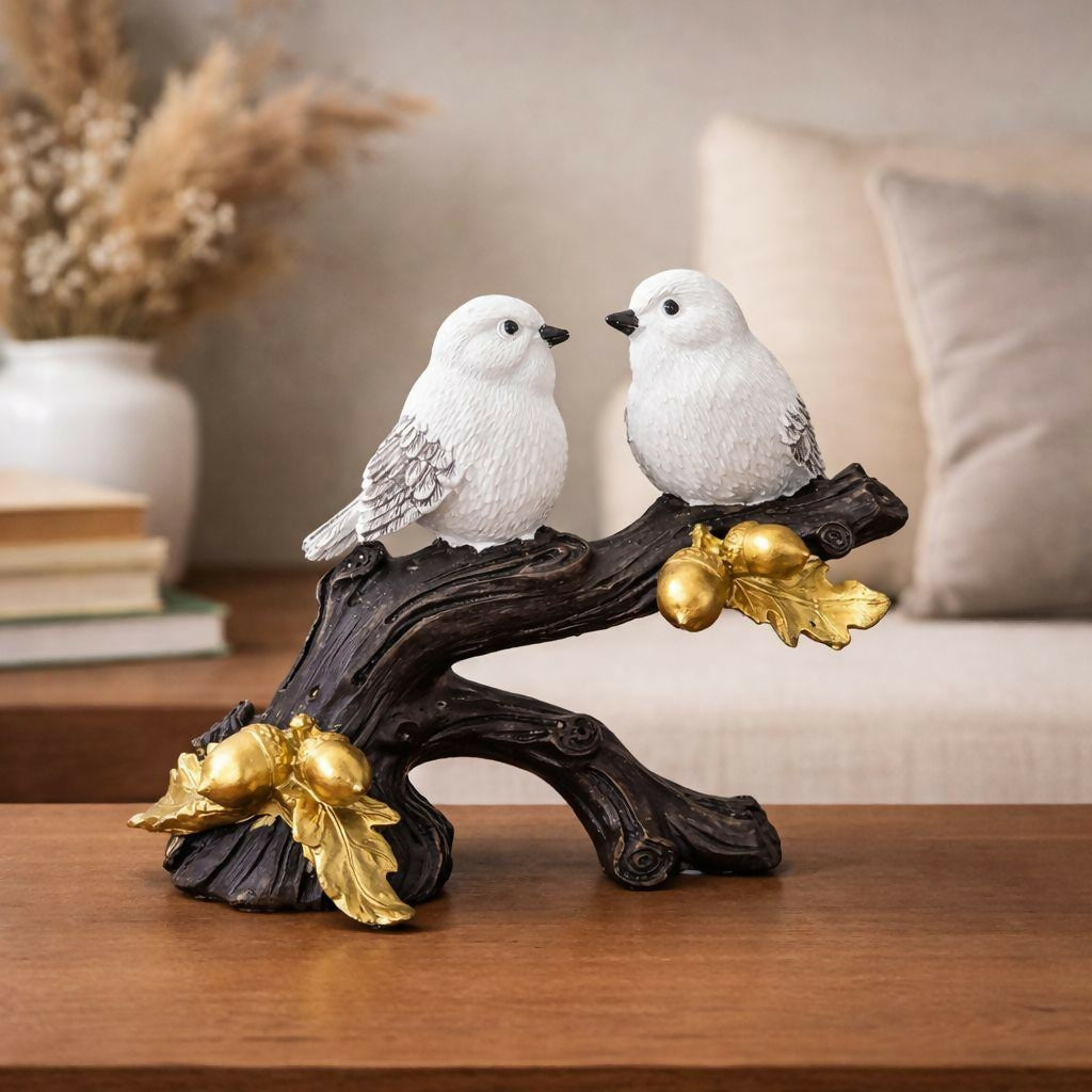 Bird couple showpiece on decorative tree branch with golden leaves