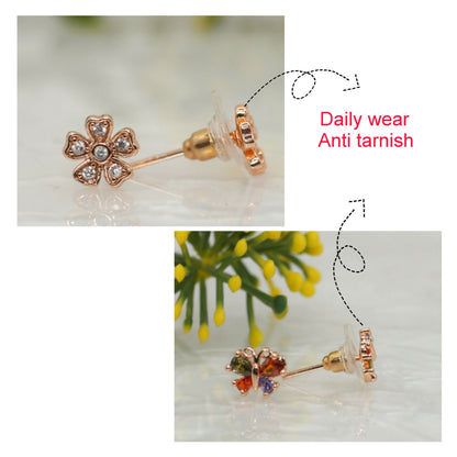 Close-up of delicate rose gold flower stud earrings with clear cubic zirconia stones