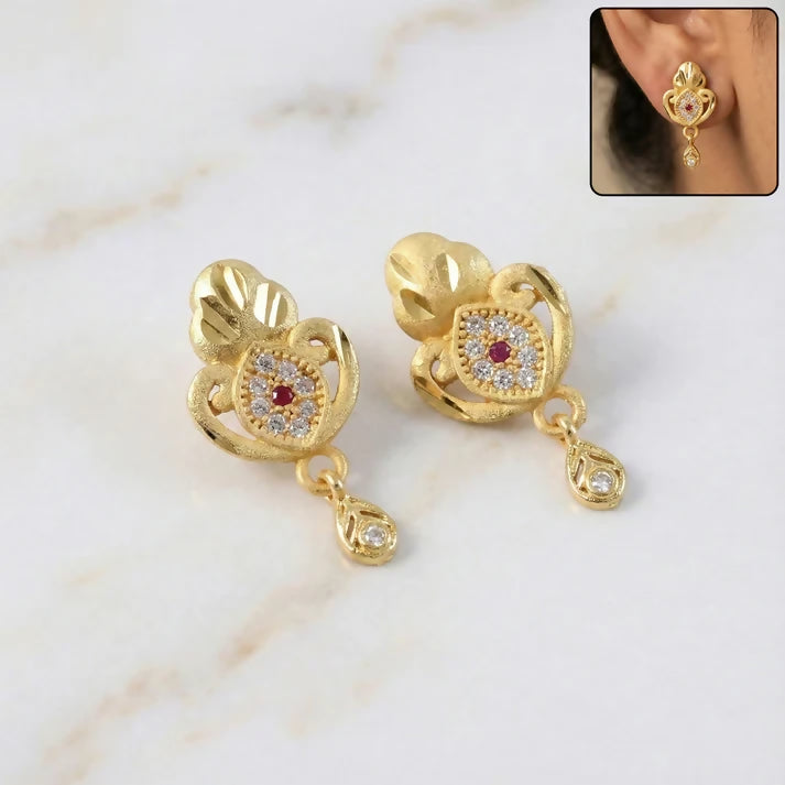 Ethnic Floral Motif Gold Stud Earrings With Stone Center And Elegant Drop Finish