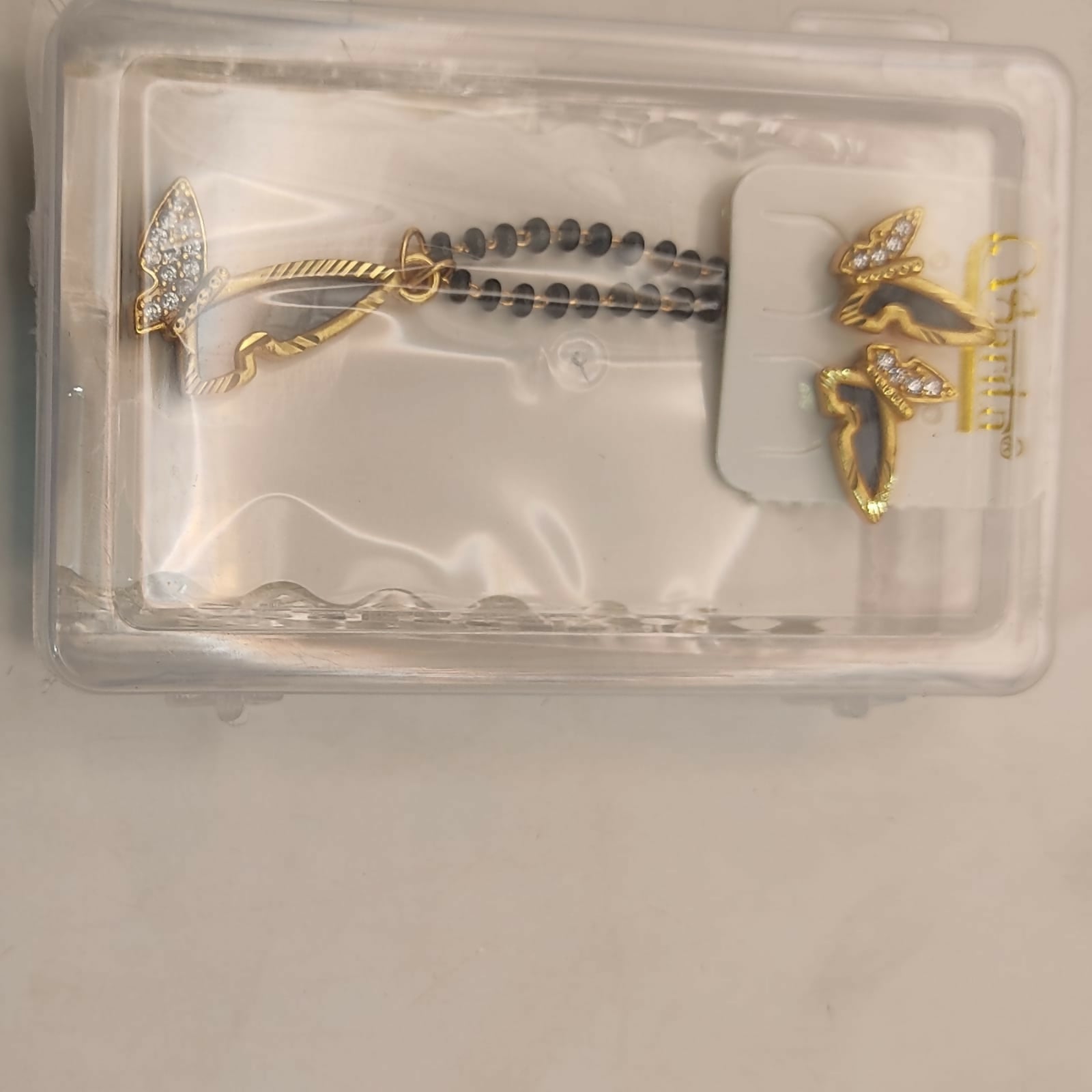 Complete butterfly mangalsutra set showcasing pendant, chain, and earrings in gold plating