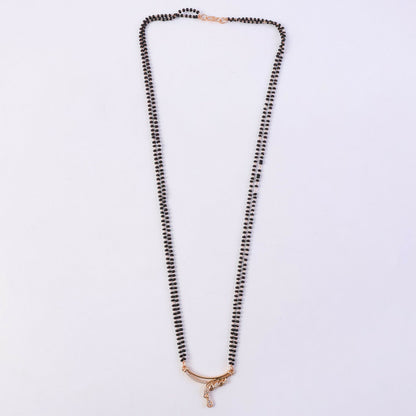 Close-up view of the CZ diamond-encrusted wave arc pendant on mangalsutra