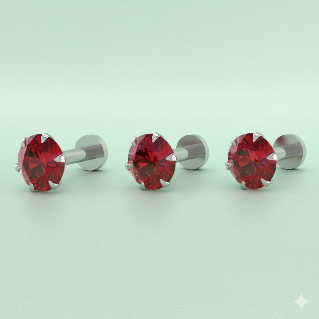 Close-up view of silver-plated red crystal nosepin stud showing crystal shine